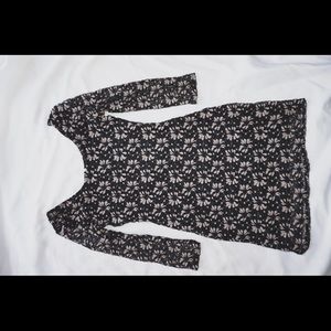 Black dress with beige flowers